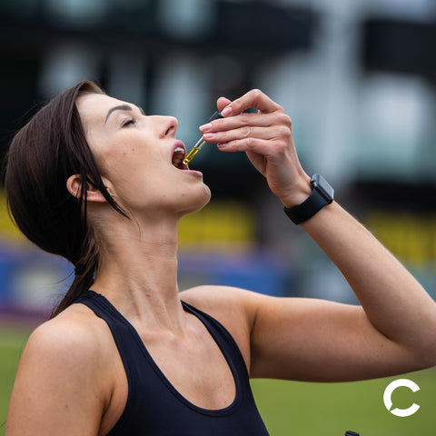 lady using pre-workout cbd oil